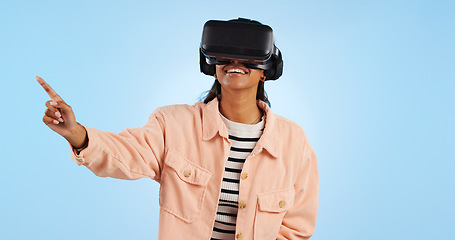 Image showing Virtual reality, press on screen and woman with future technology and smile in studio on blue background. Hologram, 3D and metaverse, digital world and high tech with user experience and VR software