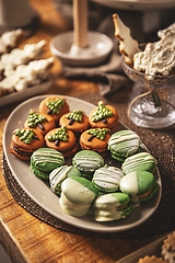 Image showing Plate with beautifully decorated Christmas macarons