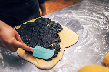 Image showing Sweet dough covered with poppy seeds.