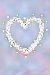 Image showing Heart Shaped Cockleshell and Pearl Wreath on Rainbow Sky