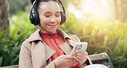 Image showing Smile, phone and woman with headphones for streaming radio, playlist and podcast or relax in outdoors. Happy female person, listening to song, sound and music or audio, nature and internet on mobile