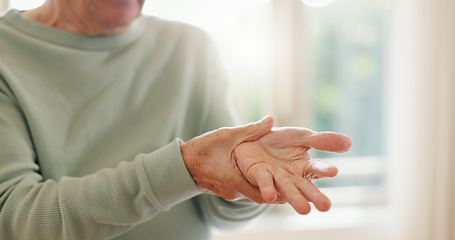 Image showing Senior person, hands and wrist with pain, injury and orthopedic wound at home. Closeup, elderly and ache for arthritis, fibromyalgia and osteoporosis of muscle joint, carpal tunnel and health risk