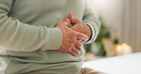 Image showing Hands, stomach pain with closeup and gut health, person has digestion issue and nutrition with elderly care. Sick, colon and gas with healthcare and wellness, help and support for stress and illness