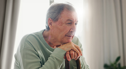 Image showing Old man, thinking and walking stick, person with disability and remember with reflection at home. Senior care, cane to help with balance and support, Parkinson or arthritis with nostalgia and memory