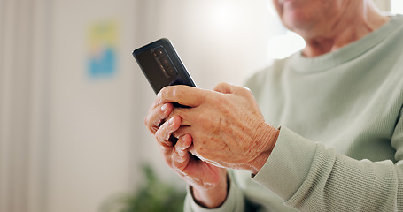 Image showing Home, closeup and senior hands with a smartphone, typing and connection with social media, digital app and contact. Old man, pensioner or mature guy with a cellphone, mobile user and search internet
