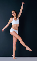 Image showing Happy woman, portrait and body in underwear for weight loss, healthy diet or fitness against a studio background. Attractive female person or model smile in slim, lean figure or health and wellness