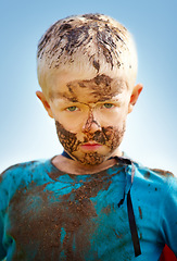 Image showing Boy, child and portrait with mud on face from playing, dirt or naughty in summer weather or water. Kid, person or grime with satisfaction for messy or dirty fun outdoor in sunshine or garden with sky