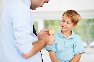 Image showing Father, son or orange fruit eat in home for healthy wellness snack, happy vitality or childhood development. Man, boy child or fresh diet together smile or organic citrus nutrition, fibre or minerals