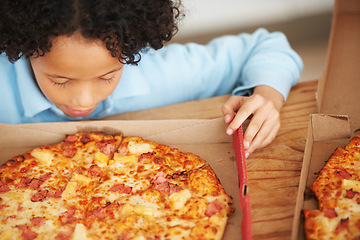 Image showing Child, boy and pizza takeaway box for hungry snack, junk fast food dinner at kitchen table. Male person, kid and hawaiian pineapple bacon meal or joy reward eating or unhealthy diet, carbs for lunch