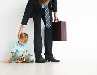 Image showing Businessman, work and home by child for sad, autism and touch head for care or stop fear, support and anxiety. Father, kid and mental health on floor to help son, tired man and professional in stress