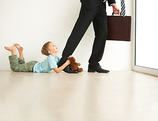 Image showing Work, home and child sad by father, pull leg and fear with anxiety, stress and mental health. Businessman, kid and tantrum on floor with dad late, professional career and accountant in family house