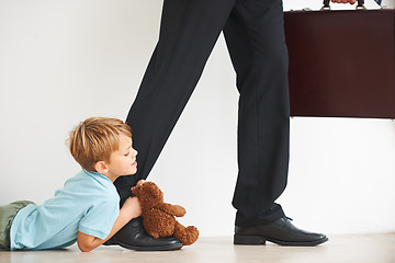 Image showing Sad, child and businessman to leave for work, tantrum and closeup with anxiety, stress or mental health. Father, kid or begging on floor to stop dad, corporate worker and professional accountant