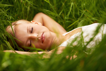 Image showing Nature face, grass field and relax woman sleep, tired or leisure for outdoor wellness, calm wellbeing or countryside peace. Girl dream, freedom and park break with green lawn, pitch or garden growth