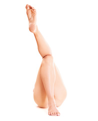 Image showing Skincare, shaving and legs of person on a white background for grooming, hygiene and wellness. Dermatology, salon aesthetic and isolated body in studio for hair removal, epilation and smooth skin
