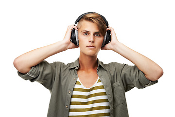 Image showing Man, portrait and DJ with headphones listening to music for audio streaming against a studio background. Young male person or sound artist with headset for podcast, beats or radio track on mockup