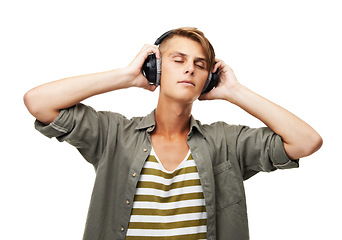 Image showing Music, listening and man with headphones in studio white background streaming audio online. Radio, sound and person relax with rock album or hip hop track on technology with freedom and peace