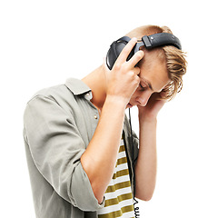 Image showing Man, headphones and listening to music for podcast, audio streaming or DJ against a white studio background. Male person or sound artist with headset for beats, songs or playlist on mockup space