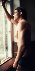 Image showing thinking, home or man in underwear for fitness in bodybuilding workout, training or exercise. Topless model, bodybuilder or thoughtful person by window with shadow, ideas or body muscle for wellness