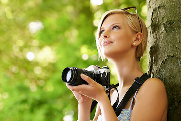 Image showing Happy, woman and photographer in nature with trees, camera and vacation in environment. Forest, park and girl filming with natural happiness outdoor on summer holiday, trip or travel with technology