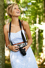 Image showing Happy, nature and photographer with woman in forest for relax, memory or travel photography. Summer, trees and adventure with female person with camera for vacation, holiday and environmental tourism