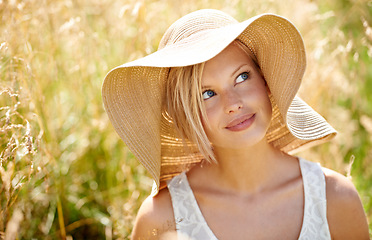 Image showing Woman, thinking and hat in wheat field or sunshine summer relax, look on farm. Female person, idea and grass straw meadow nature for fresh clean air countryside or plants park, weekend rest or rural