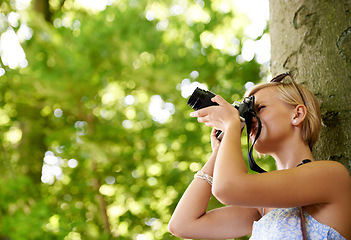 Image showing Woman, photographer and shooting in nature with trees, camera and memory of environment mockup. Spring, park and freelancer filming forest outdoor on summer holiday, trip or travel with technology