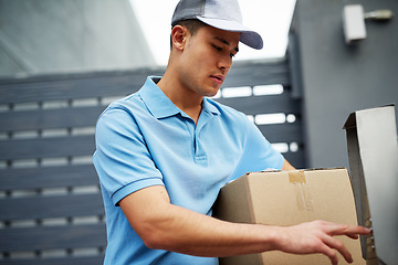 Image showing Box, entrance or doorbell with a delivery guy by home for entrance for online shopping or product. Apartment, button press or courier man by buzzer to enter a house for ecommerce service or package