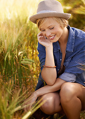 Image showing Field, thinking and woman with sunshine, smile and ideas with tourism, adventure and countryside. Person, travelling and girl with happiness, daydreaming and fantasy with fresh air, relax and journey