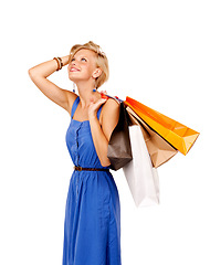 Image showing Woman, thinking and shopping bag for fashion sale, discount and retail choice, inspiration or decision in studio. Happy customer or person search for gift ideas and clothes on a white background