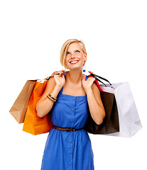 Image showing Happy woman, shopping bag and thinking of retail discount, sale and giveaway or fashion choice on white background. Customer or excited shopper with ideas, clothes decision or commerce loan in studio