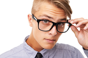 Image showing Spectacles, vision and portrait of man in a studio with confused, doubt or squinting facial expression. Optometry, health and young male person with glasses or eyewear isolated by white background.