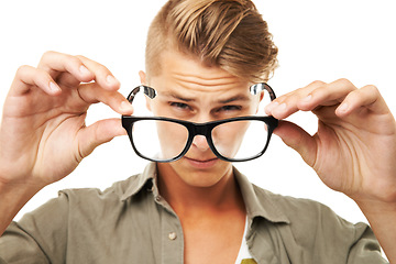 Image showing Blind, eyesight and man squint with glasses in studio, white background or closeup on eyewear. Portrait, mockup and person with eyes struggling with prescription, eyeglasses and spectacles for vision
