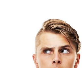 Image showing Young man, head and thinking or looking up on mockup isolated against a white studio background. Cropped face of handsome male person, hipster or model in wonder or thought for ideas or solution