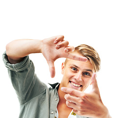 Image showing Happy man, portrait and hands framing face for photography isolated against a white studio background. Attractive young male person or model with smile or frame gesture for picture, photo or capture