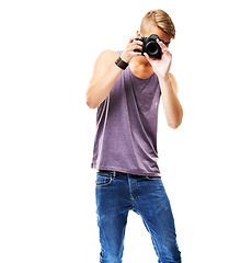 Image showing Photographer, shooting and portrait with a camera in studio, space and white background. Digital, photography and man with confidence, pride and creative work with paparazzi, videography or model