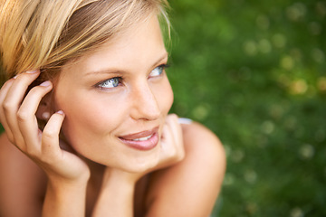 Image showing Thinking, outdoor and woman with nature, smile and fresh air with ideas, daydreaming and summer. Park, person and girl with wonder, choice and calm with peace, grass and environment with decision