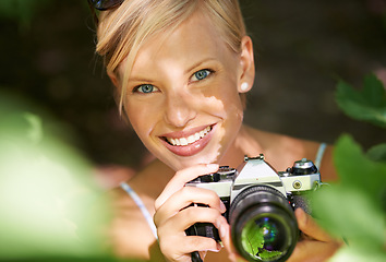 Image showing Portrait, photographer and camera lens with woman in forest for trees, environment and relax. Shooting, nature and photography with face of female person in woods for travel, tourism and summer