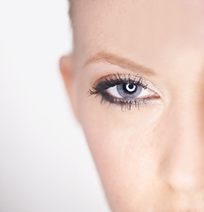 Image showing Beauty, eye and half portrait of woman with natural makeup, facial spa treatment and aesthetic dermatology in studio. Vision, skin care and face of model with light, wellness and white background.