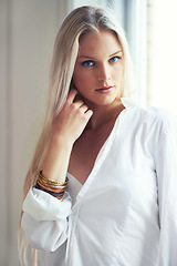 Image showing Portrait, woman and thinking for idea with fashion in bedroom with hand on face. Norway, female person and blonde hair for looking with expression for vision in clothes, casual and style with jewelry