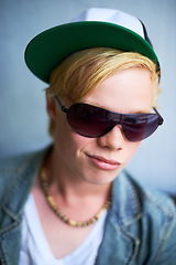 Image showing Fashion, sunglasses and a cool young boy in studio on a gray background for trendy youth style. Portrait, children and attitude with a confident kid in shades to wear an outfit as a teenage youngster