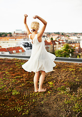 Image showing Dance, city and a woman for freedom on a rooftop, quiet and happy in summer. Back, retro and a young girl or vintage dancer in a field or nature for moving, carefree and pride as a ballerina