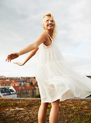 Image showing Woman, happy and dancing on holiday, summer and outdoor for vacation, smiling and city. Freedom, dancer and urban area for break, getaway and carefree on trip, countryside and amsterdam spring time