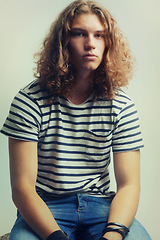 Image showing Tshirt, jeans and portrait of man with fashion in studio background with gen z college student. Casual, style and person with indie, hipster or stylish model at university campus and backdrop