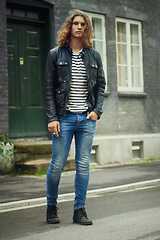 Image showing Man, portrait and fashion, streetwear and clothes with hair and pose in street or city in denim. Urban, young and gen z with serious model outdoor, casual outfit and hipster, cool and trendy