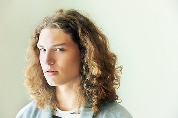 Image showing Man, headshot and hair with beauty in portrait, mockup space with curly hairstyle and wellness. Young, gen z and casual clothes with curls, style and trendy, cool model and relax with fashion