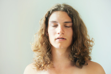 Image showing Man, face and breathing in meditation with peace, zen and spiritual exercise to relax. Calm, person and thinking in holistic, yoga and healthy practice for mental health and white background