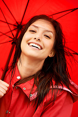 Image showing Woman, smile and happy with umbrella in closeup, positive and ready for weather, storm and cold. Insurance, red raincoat and portrait or face, prepare and fashion or color, zoom and casual style