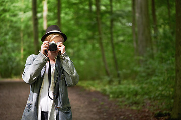 Image showing Photographer, nature and man with a camera, adventure and tourism with a view, journey and freedom. Person, photography and guy with mountains, traveller and retro with landscape, creative and trees