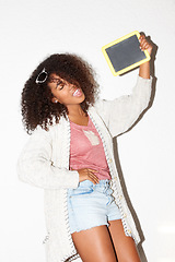 Image showing Crazy, cool and a black woman with a blackboard for an announcement, marketing or advertising. Happy, fashion and an African girl with a chalkboard for information, message or a sign on a wall