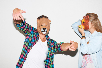 Image showing Animal, mask and portrait of people on Halloween in costume or cosplay in white background. Funny, lion and bear masks for creative masquerade on holiday, event or party with friends together